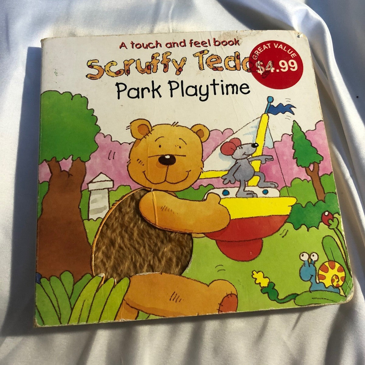 Cover page of A Touch and Feel Book Scruffy Teddy Park Playtime